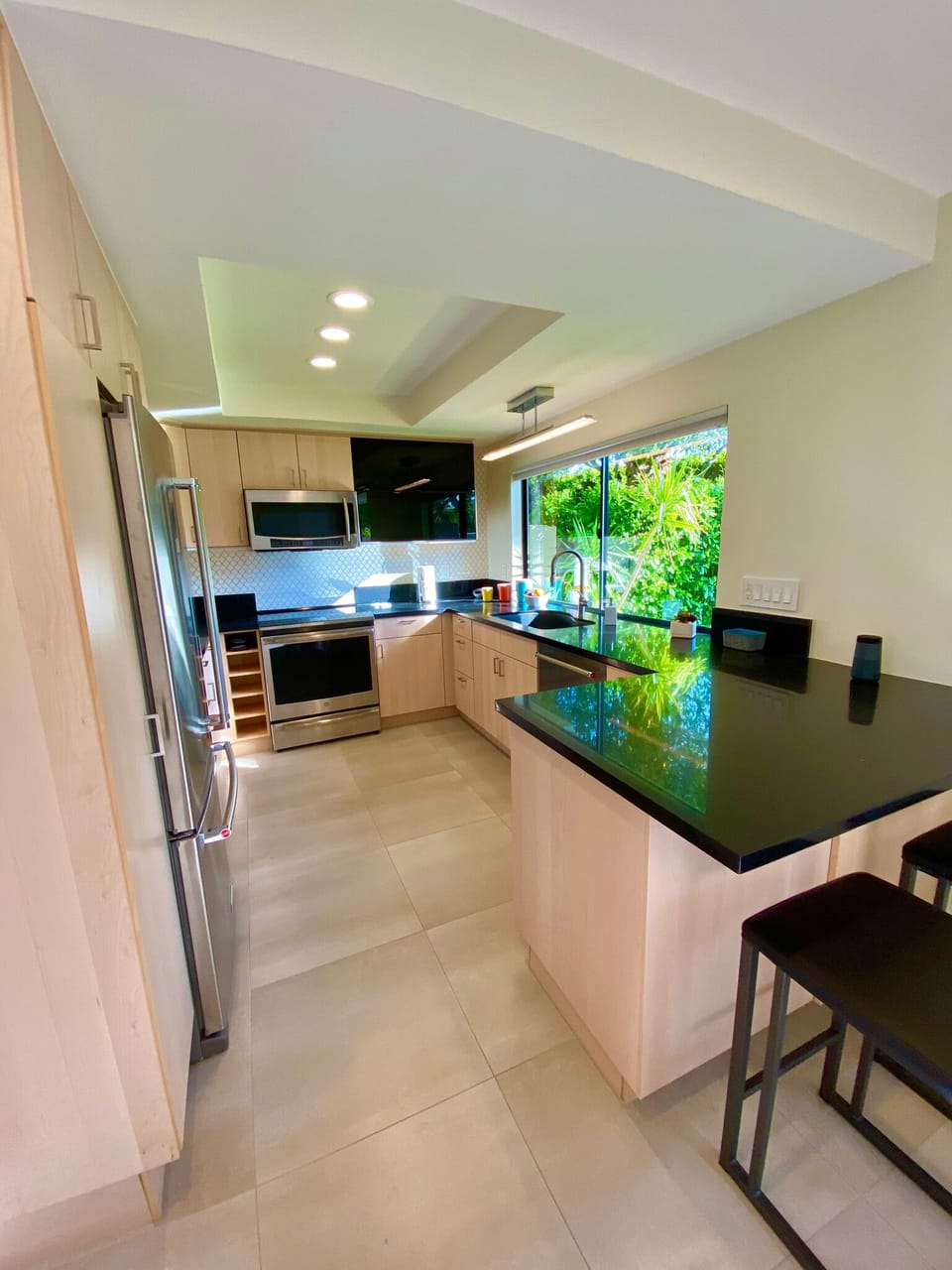 Open concept kitchen with countertop bar seating for two