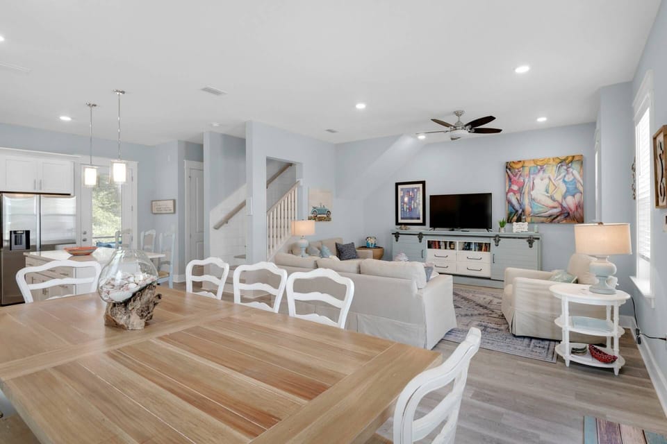 Open concept living area with warm natural lighting