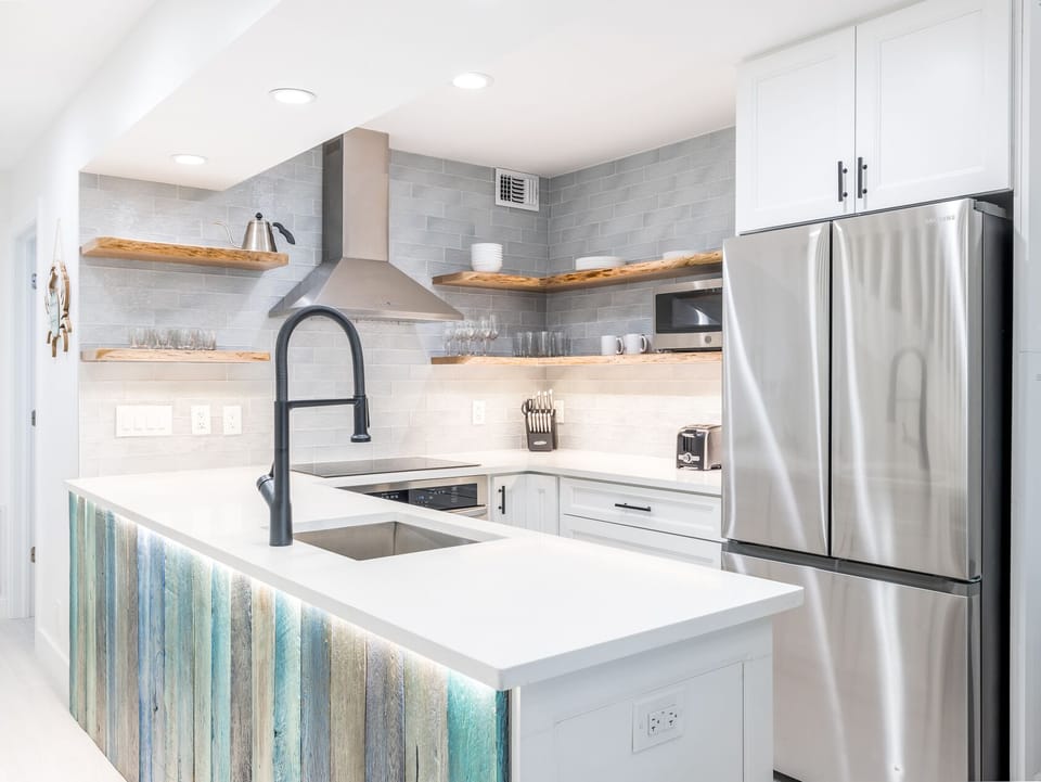 Cook with ease on bright counters and sleek stainless appliances.