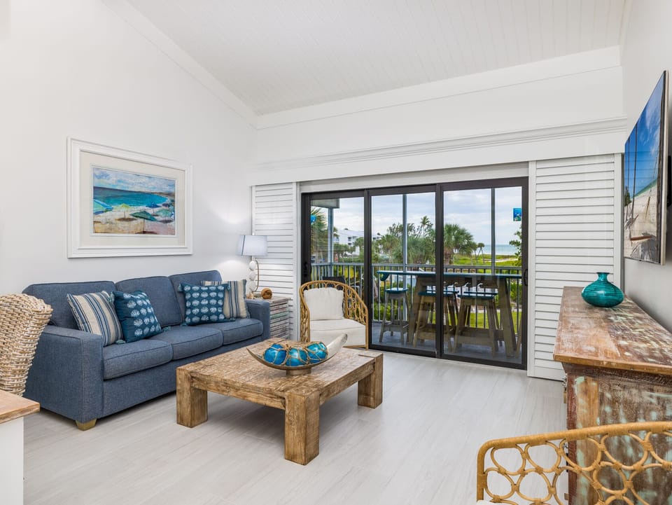 Lounge on the sofa and soak up balcony breezes.