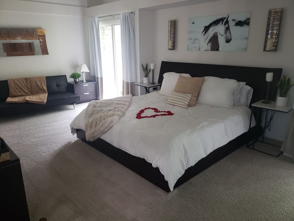 King size bed with two futons available in the master bedroom