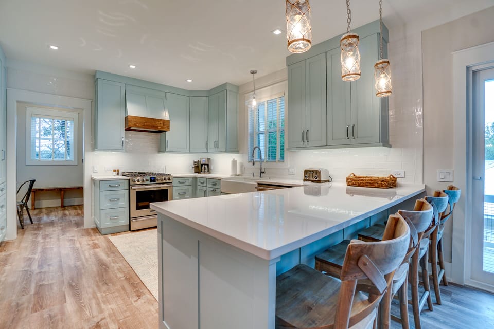 This huge gourmet kitchen awaits, complete with 5 burner gas range