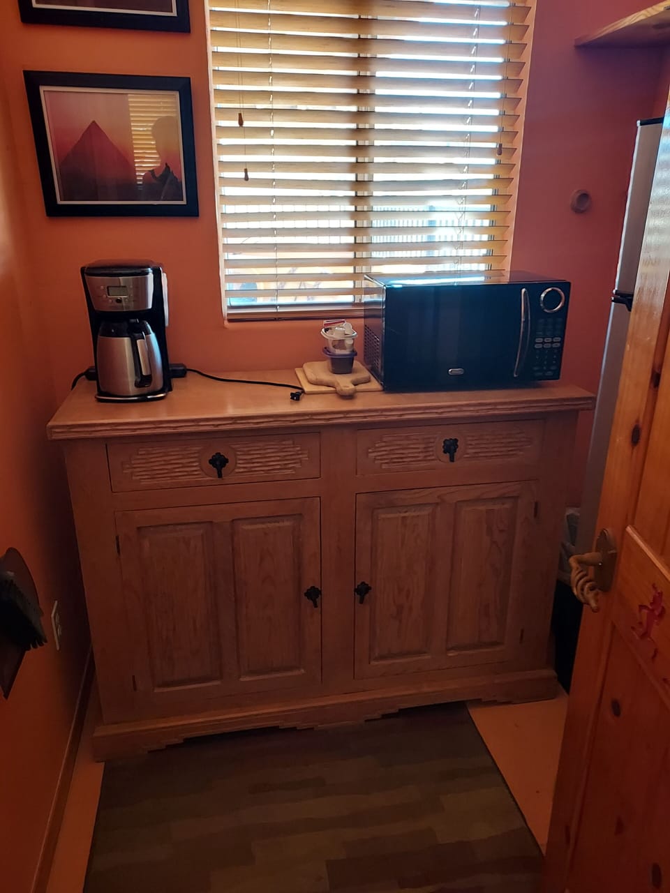 coffee pot, microwave, dishes and utensils. 