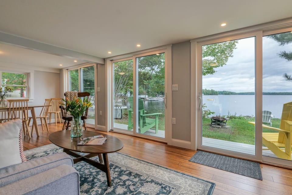 Living room with lake views and sliding glass doors