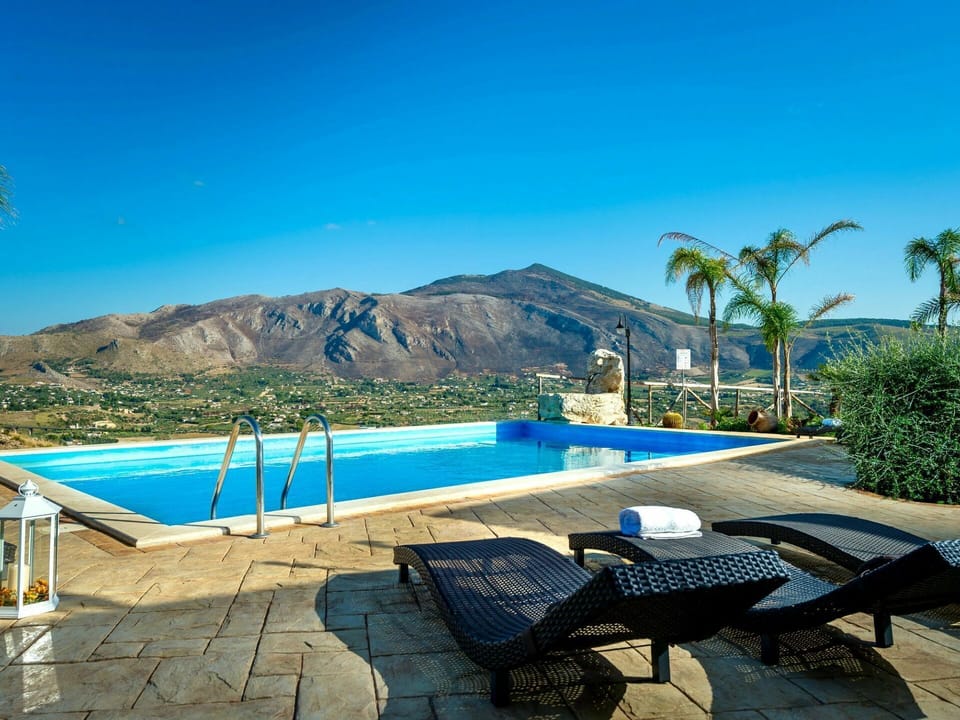 Water, Sky, Plant, Swimming Pool, Azure, Outdoor Furniture, Tree, Mountain, Shade, Sunlounger