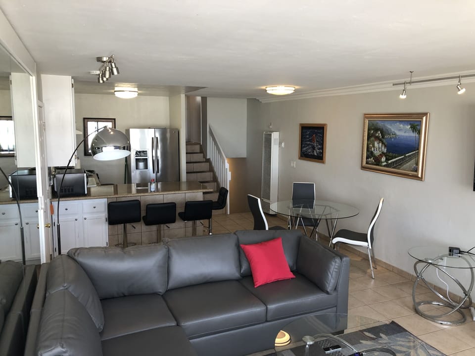 Dining area includes a round table and granite bar that can seat 10 plus.