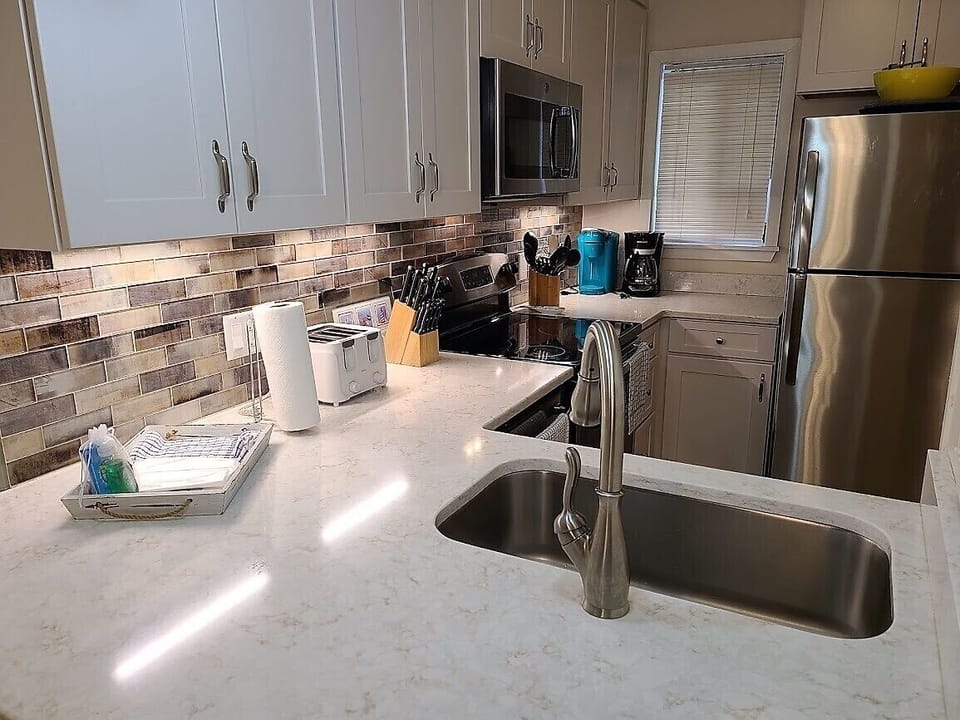 Enjoy the upgraded kitchen with quartz countertops & stainless steel appliances