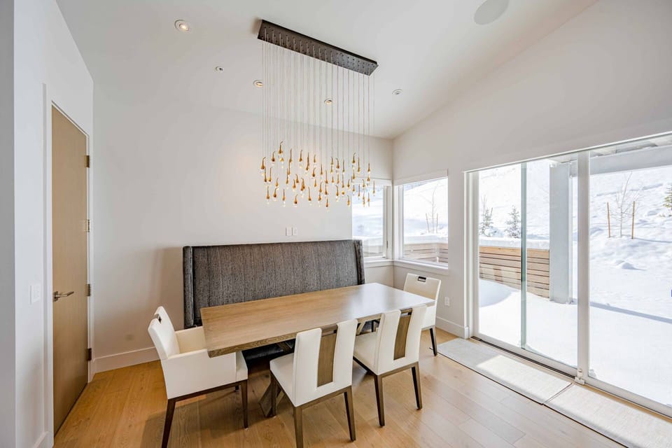Dining area with seating for the full group, positioned within the open-concept layout for shared meals and gatherings.