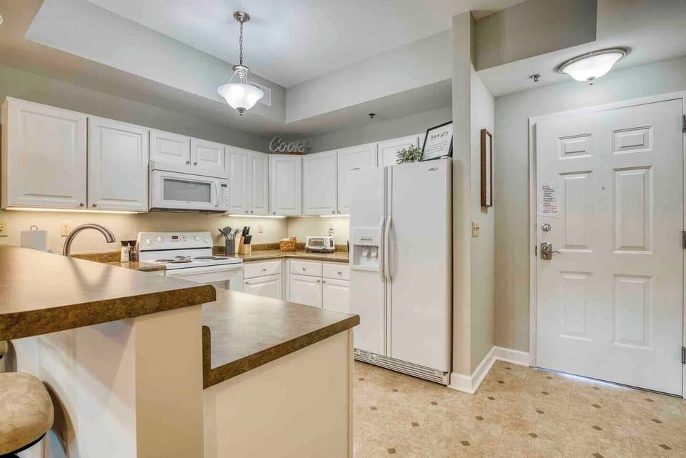 The kitchen is quite spacious, providing ample room for meal preparation.