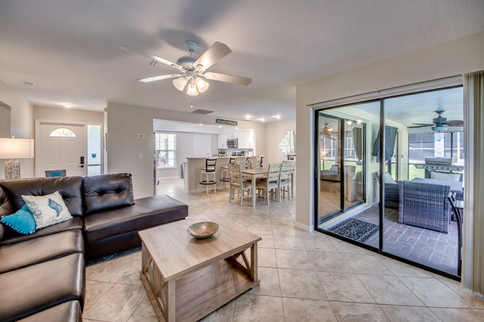 The newly furnished living room has plenty of seating for your entire family! 