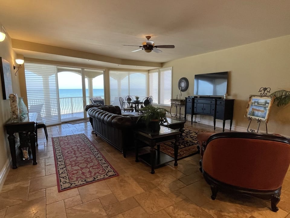 Living room with view to balcony and gulf beyond!