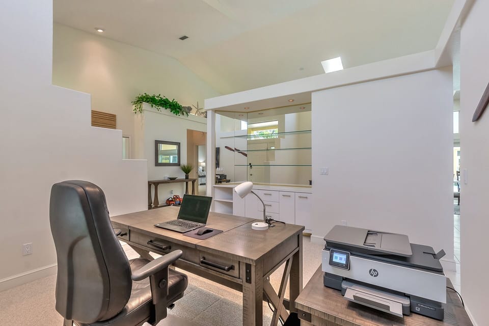 Printer and leather office chair.