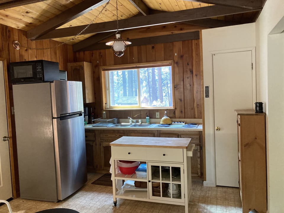 Kitchene has stove, coffee maker, fridge, microwave, toaster oven, & toaster. 