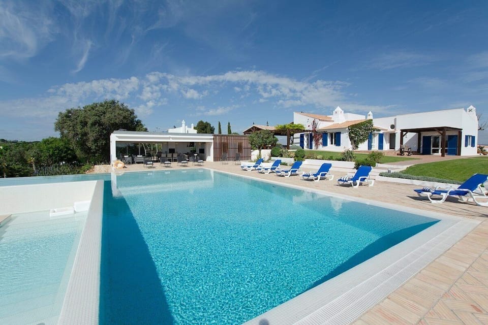 Private pool and sun terrace with blue loungers — Villa Alfarrobeira, luxury holiday villa in Lagos