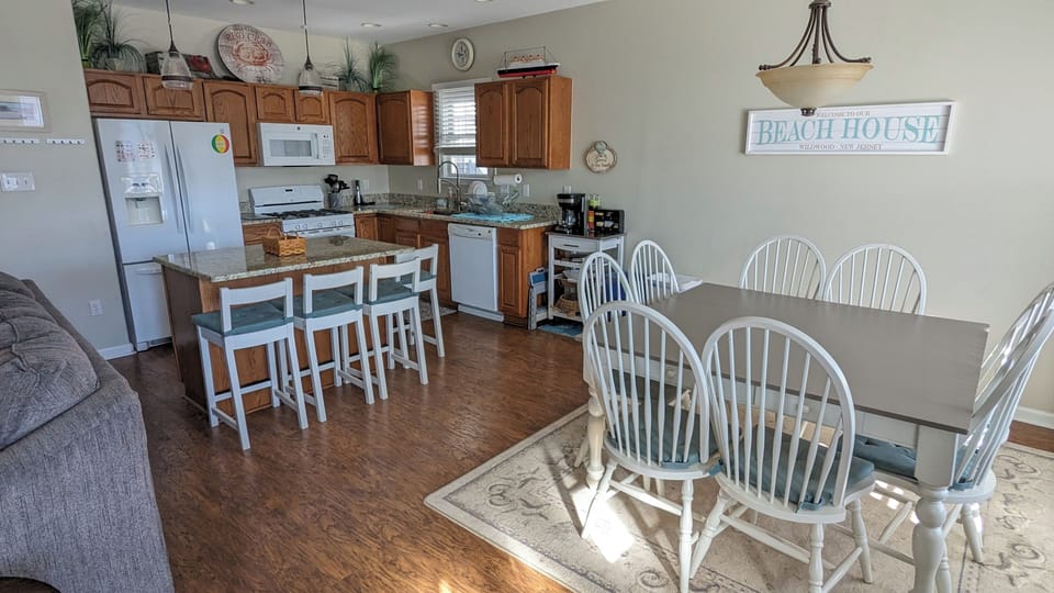 Ample seating either at the kitchen island or dining table. 
