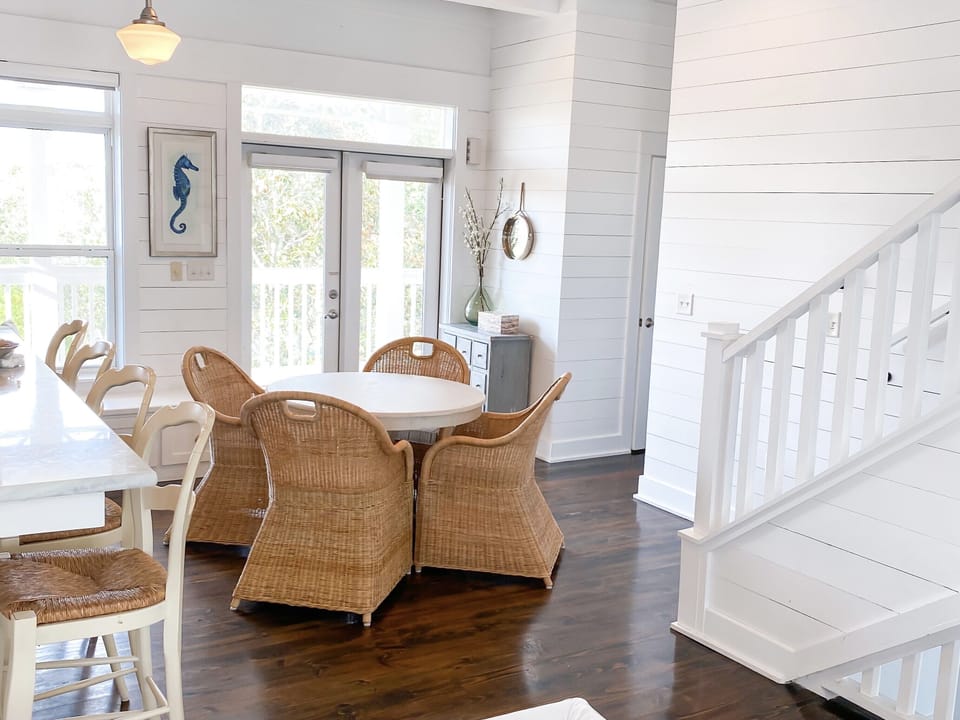 Open concept kitchen/dining/living area with ocean views. Updated table & chairs
