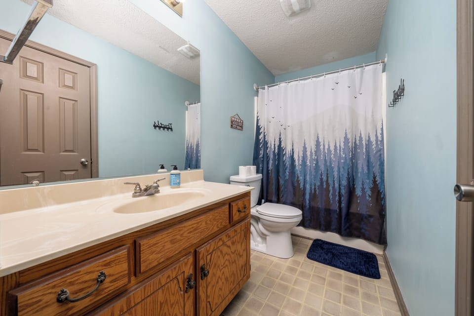 Full master bathroom with shower tub combo