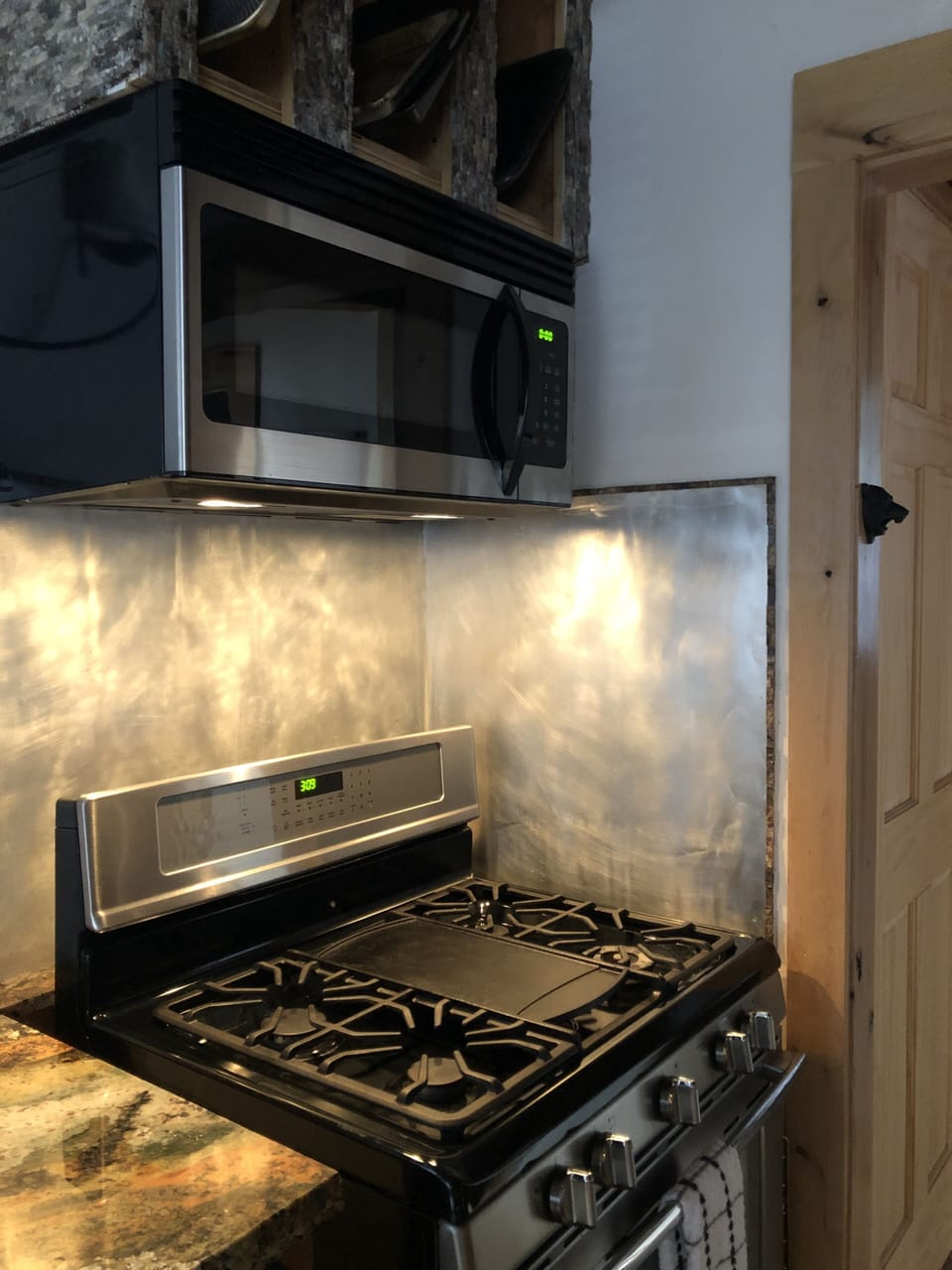 Gas stove top and oven with microwave.