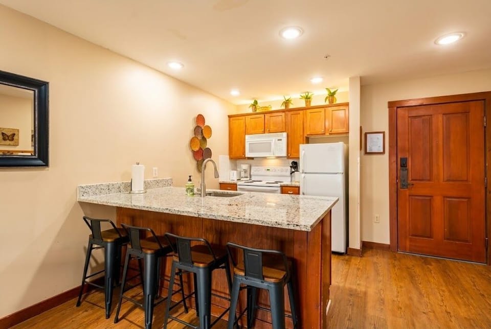 Our modern kitchen features a beautiful island with bar stools.