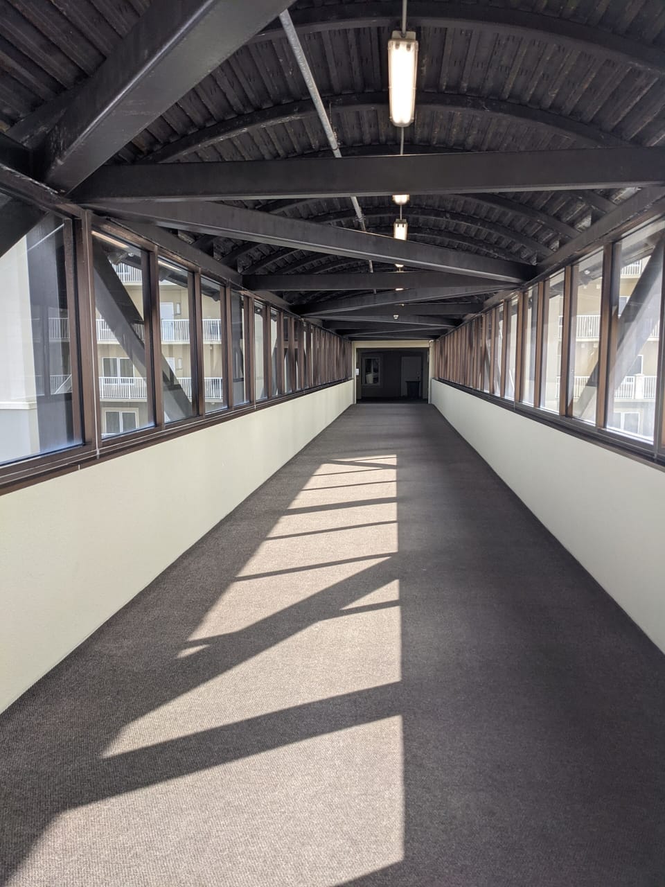 Convenient covered walkway from covered parking garage to Tower 1 on level 5.