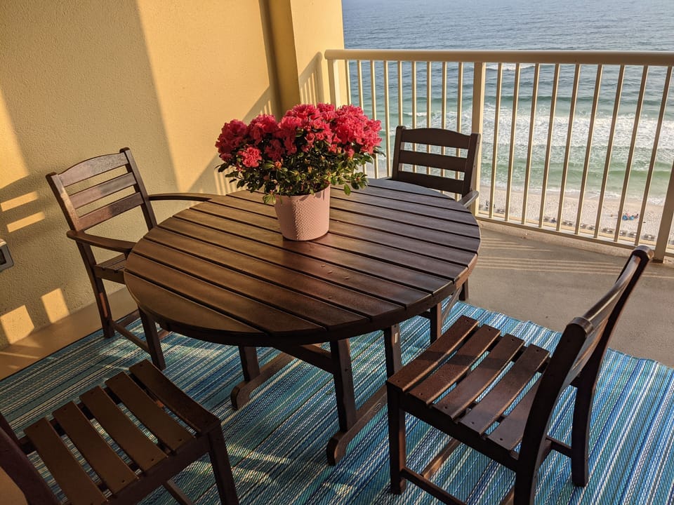 Enjoy a meal on the spacious balcony with an ocean front view.