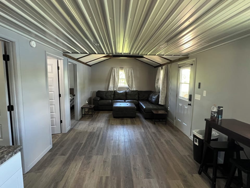 Living room with sectional couch and Roku TV
