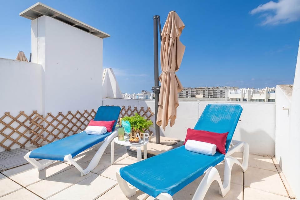 Pool with sun loungers, chairs and table