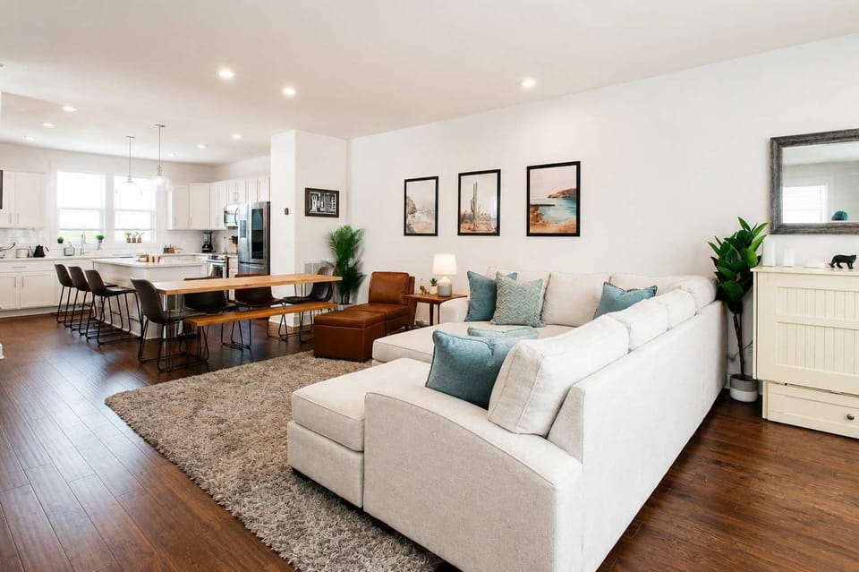 Bright open-concept living, dining, and kitchen area, perfect for relaxing, gathering, and entertaining.