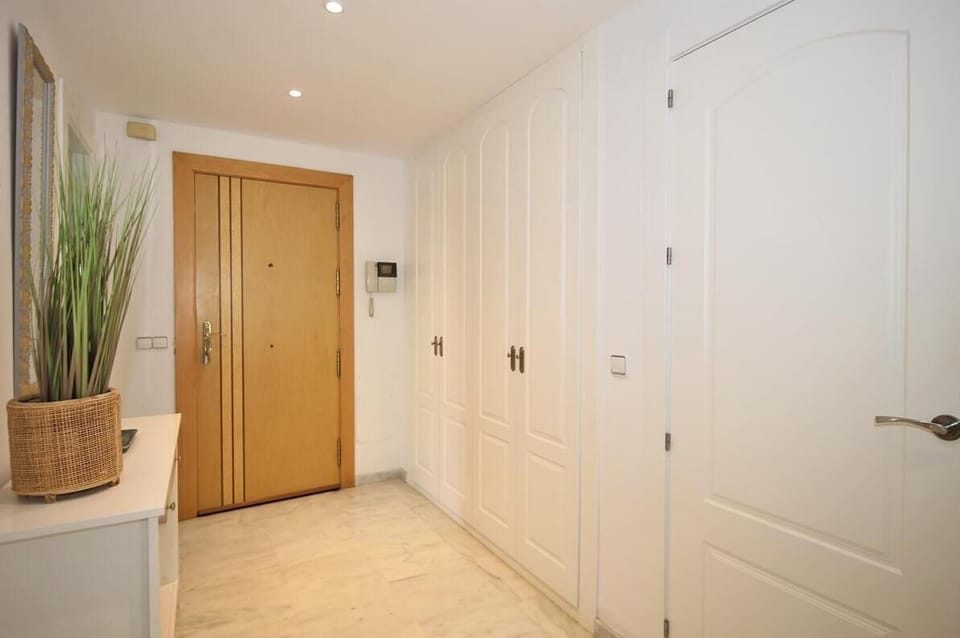Apartment entrance with spacious built-in cupboards