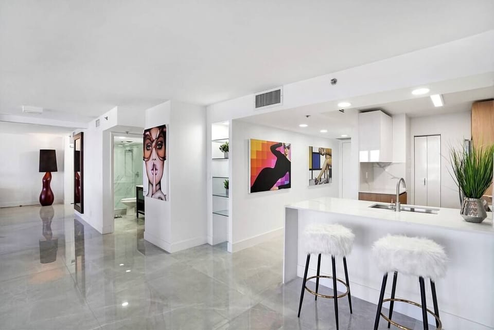 Front entryway, fully equipped kitchen with seating for 2 at counter