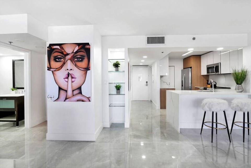 Front entryway, fully equipped kitchen with seating for 2 at counter