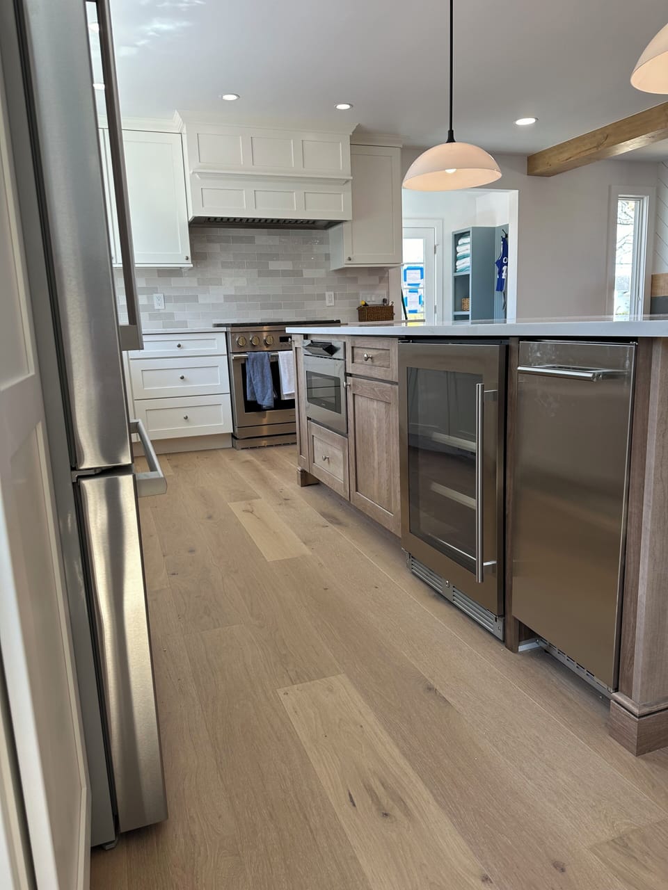 Island that features a separate ice maker, beverage center and microwave