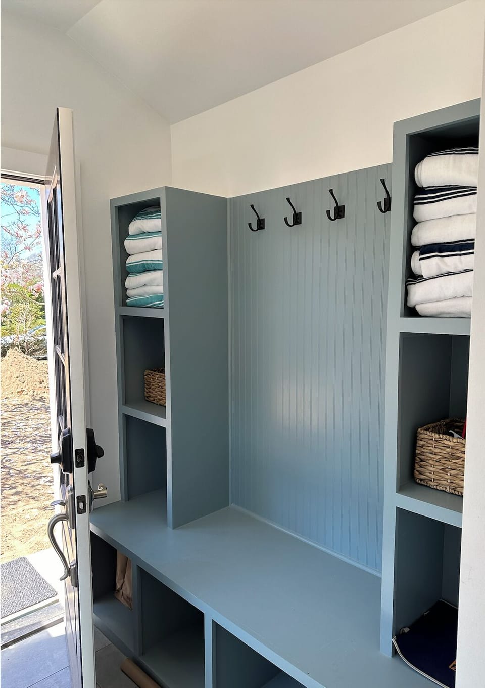 mudroom entry with space for shoes, towels, etc. 