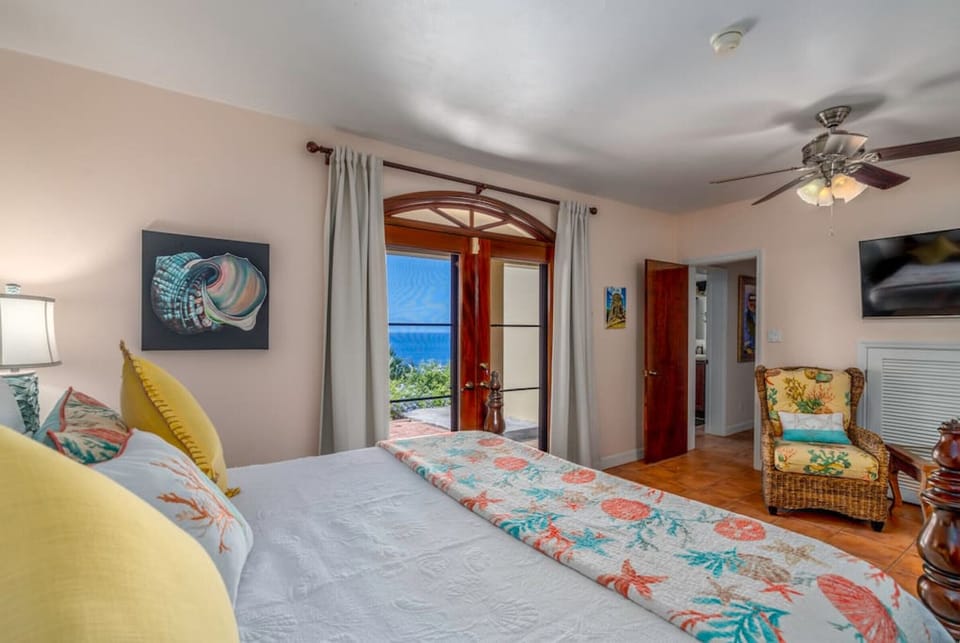 bedroom 5, lower level with flat screen TV, AC, king bed, and private deck.