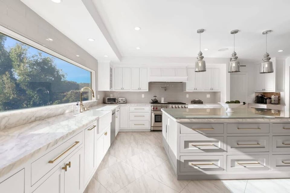 State of the art modern kitchen featuring Wolf appliances.