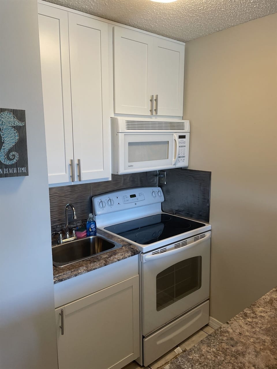 Full size stove and microwave.