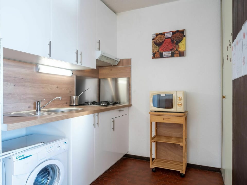 Cabinetry, Laundry Room, Property, Furniture, Picture Frame, Countertop, Building, Kitchen Appliance, Kitchen Stove, Wood