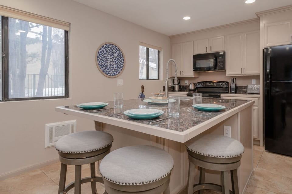 Dine-in kitchen.  Additional stool in closet for a fourth seat.