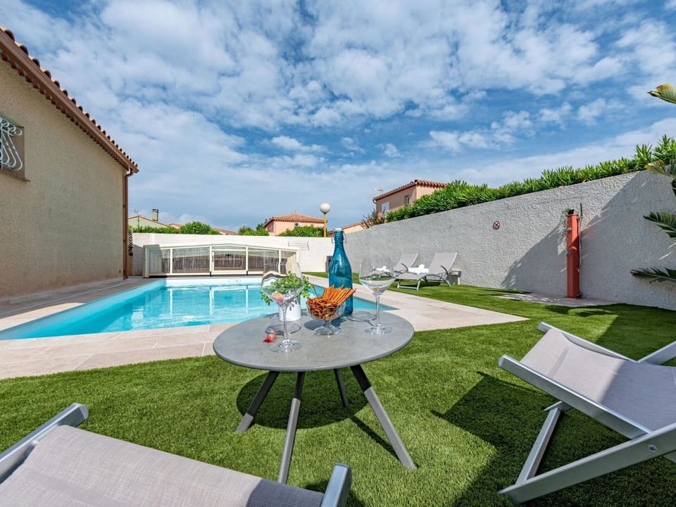Cloud, Water, Property, Sky, Plant, Building, Outdoor Furniture, Swimming Pool, Grass, Leisure