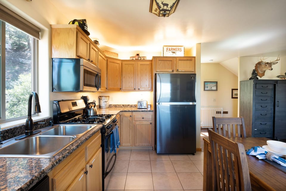 Complete kitchen convenience: stove, microwave, dishwasher, coffee maker, fridge, and more!