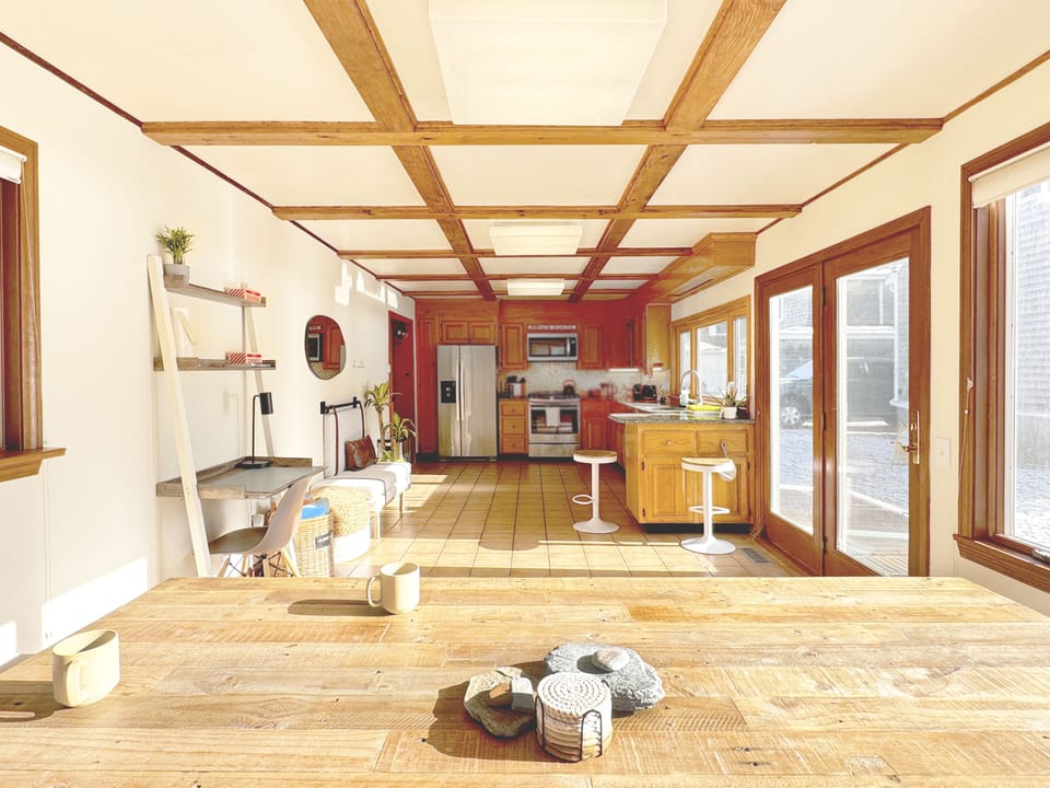 Dining area has large picture window overlooking the bay.