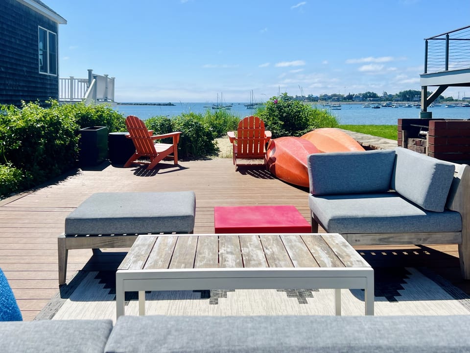 Lounge on deck overlooking harbor in Summertime 
