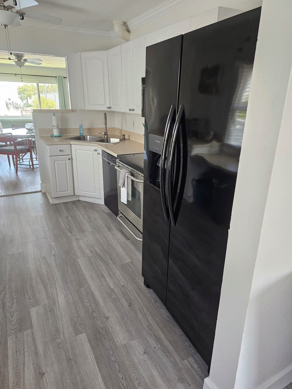 Galley Kitchen with full size refrigerator, oven & Dishwasher. 