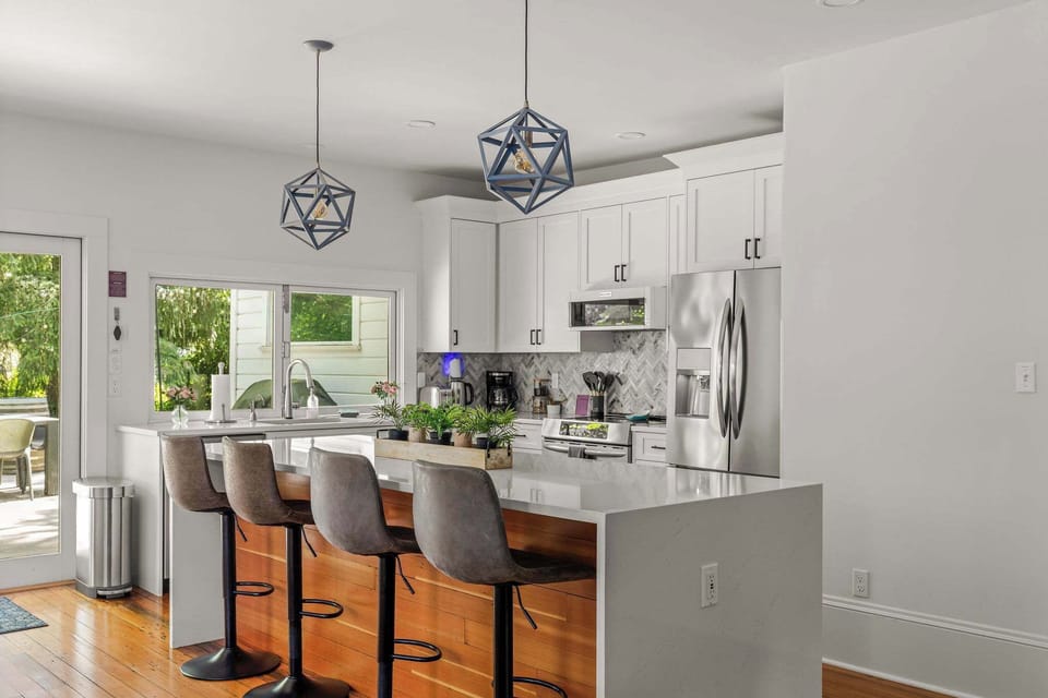 Gather around the spacious island in a bright chef-inspired kitchen.