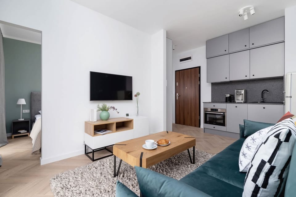 Enjoy your favorite shows on the flat-screen television in the elegant living area.