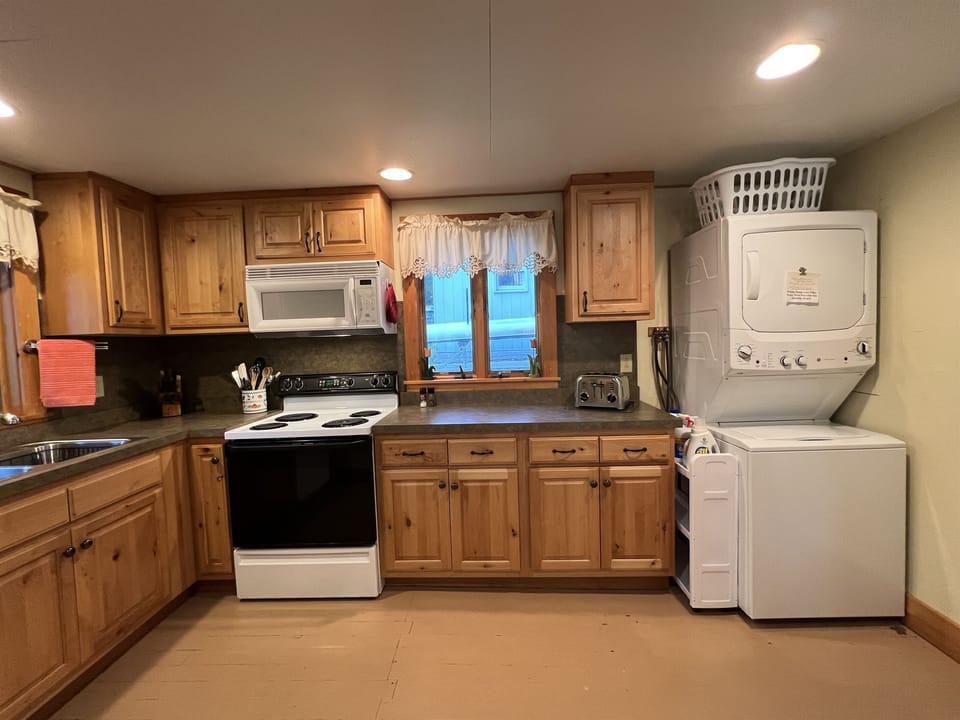 Kitchen with washer/dryer.