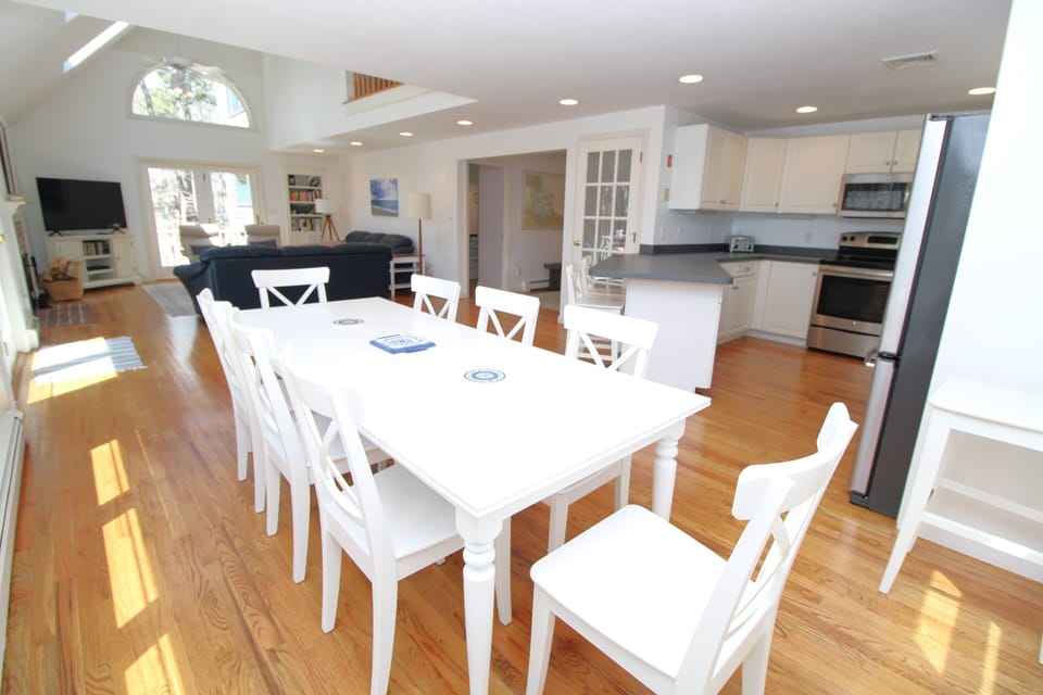 Dining with family room and kitchen in background