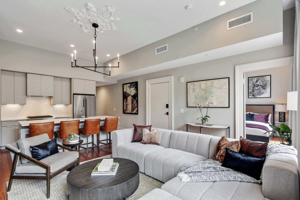 Living Room | Dining and Sitting Area with Chandelier | Third Floor of Building — Unit on One Level
