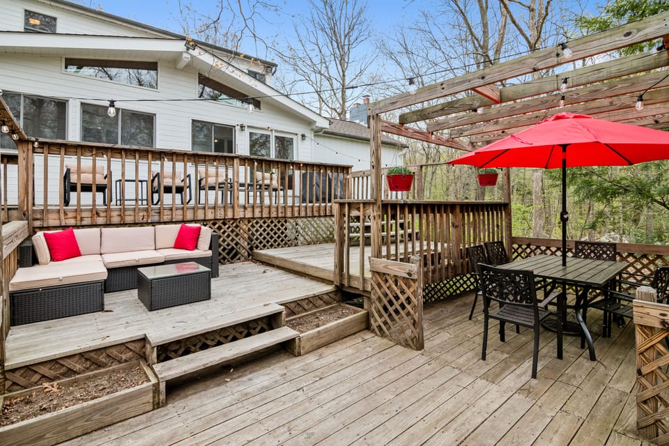 Relax on the back porch with 3 tiers of seating for 14 people with our 3.5 acres