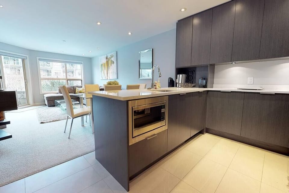 Modern fully equipped kitchen, overlooking dining and lounge area. (1)